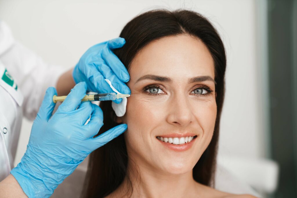 Woman getting face treatment | Aesthetic Arts Medical Spa and Wellness in Great Neck, NY